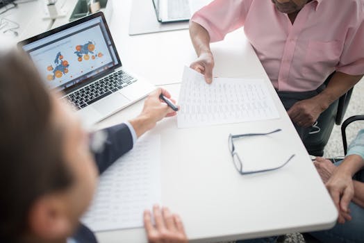 senior couple looking at mortgage documents