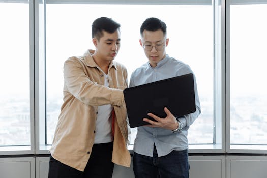 person using a laptop to manage finances