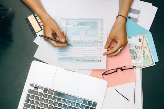 tax documents and calculator on a desk