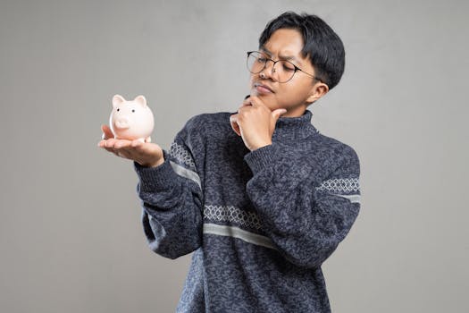 person saving money in a piggy bank