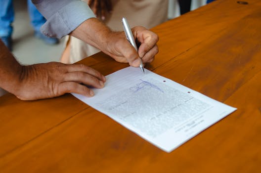 person signing employment contract