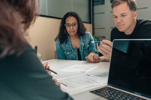 financial advisor meeting with retired couple