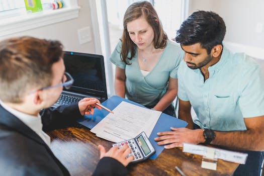 senior couple discussing finances with advisor