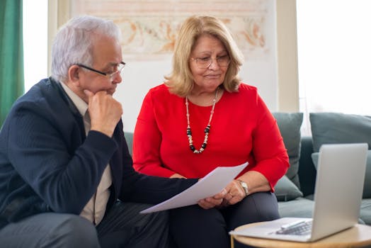 retired couple discussing finances at home