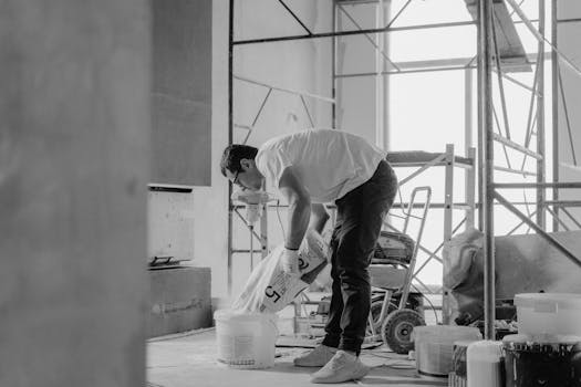 construction site with workers building a house