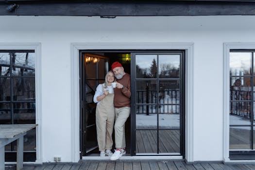 retired couple reviewing blueprints with a builder