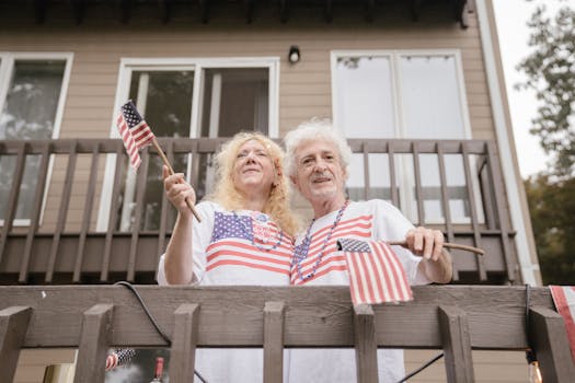 senior couple smiling in front of their new home