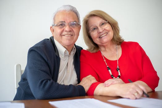 senior couple reviewing documents and smiling