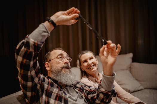 older couple smiling while reviewing finances