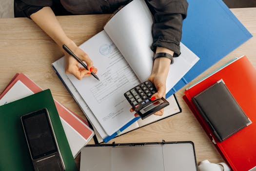 calculator and notebook on a desk