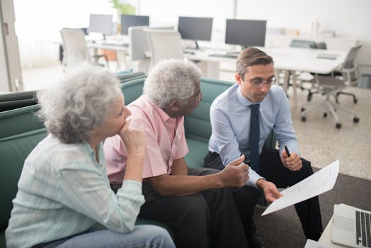 retired couple discussing finances with advisor