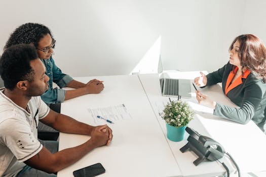 retired couple discussing finances with advisor