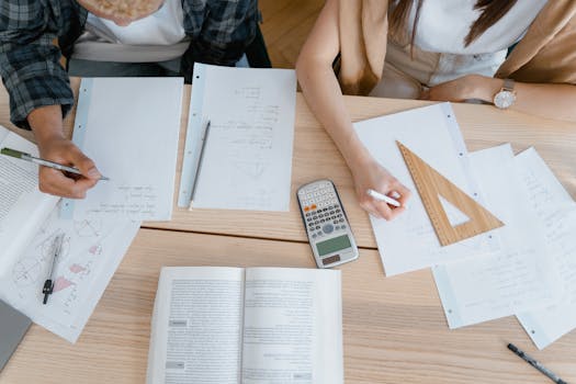 calculator and mortgage papers on a table