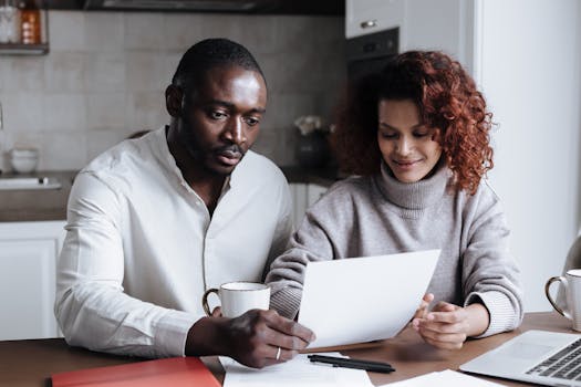 retired couple reviewing financial charts and documents