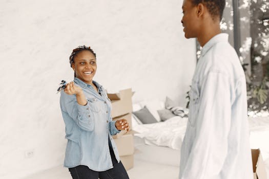 senior couple smiling while holding house keys