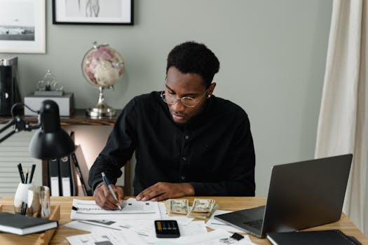 calculator and financial documents on a table