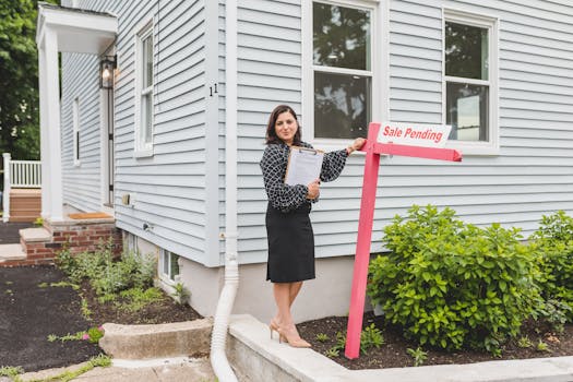 house with a for sale sign