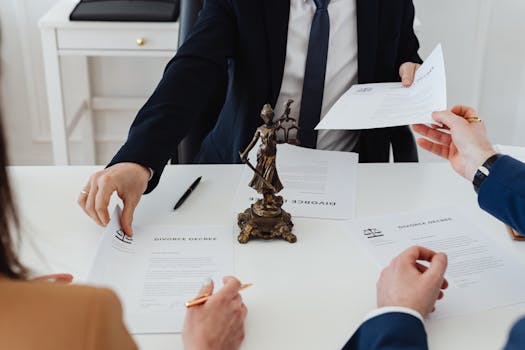 close-up of a hand signing mortgage closing documents