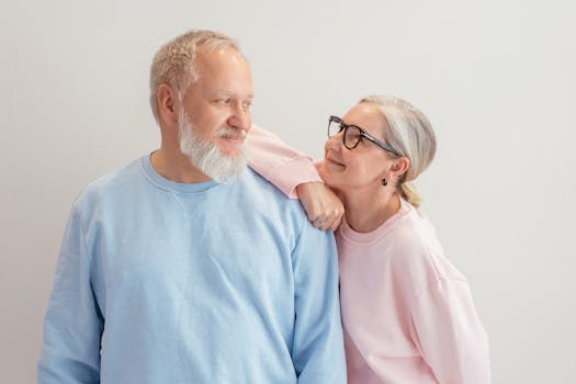 senior couple looking at a smaller home model