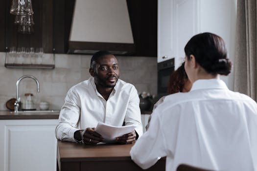 family reviewing financial documents at kitchen table