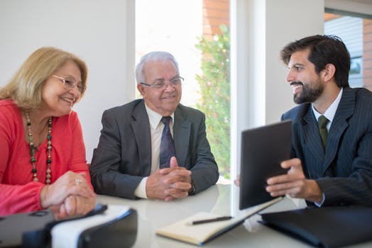 senior couple smiling while reviewing investment portfolio