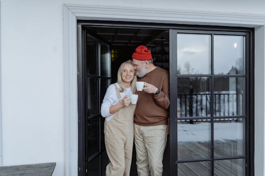 retired couple enjoying coffee outside their converted bus