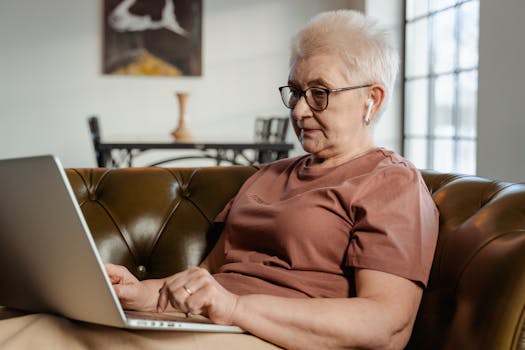 retired woman working on her laptop