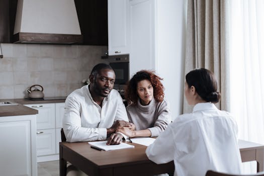 family discussing finances at the kitchen table