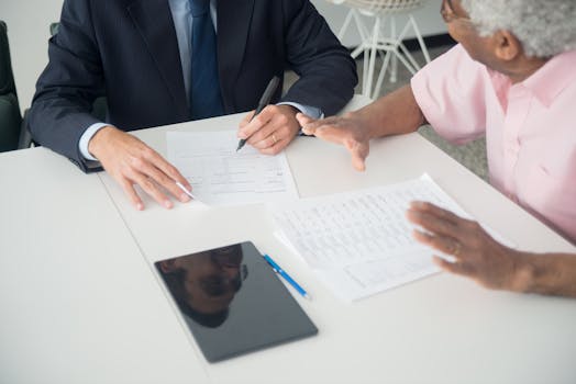 retired man discussing mortgage options with a financial advisor