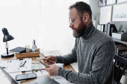 retired man organizing financial documents