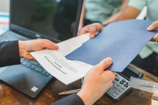 couple signing mortgage documents