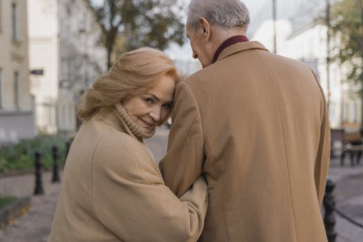 senior couple walking through a neighborhood