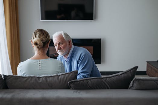 senior couple in front of a new home