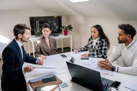 group of professionals discussing financial documents