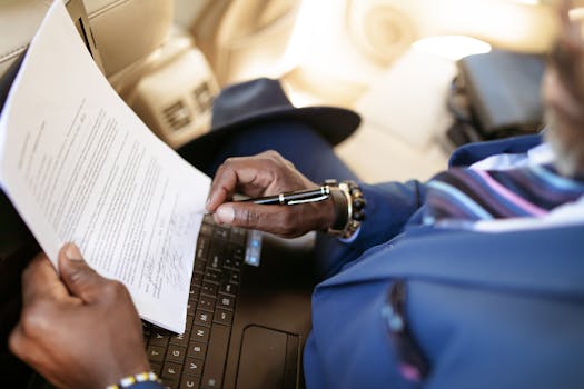 close-up of a person signing a document