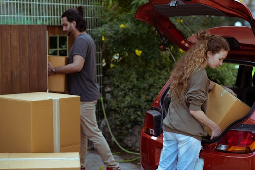 family packing boxes for moving