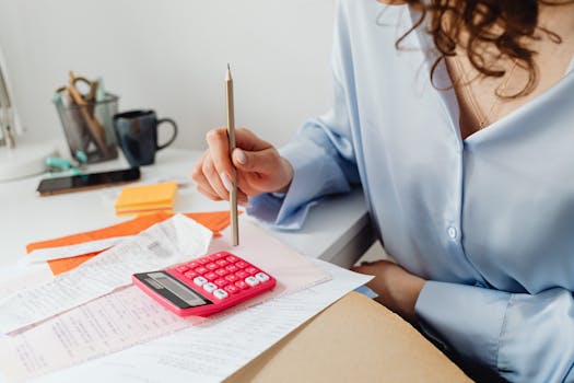 retiree calculating expenses at a desk