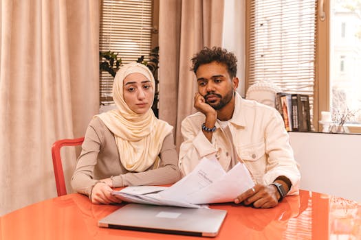 retired couple reviewing documents at home