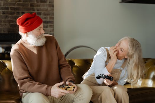 retired couple smiling while reviewing finances