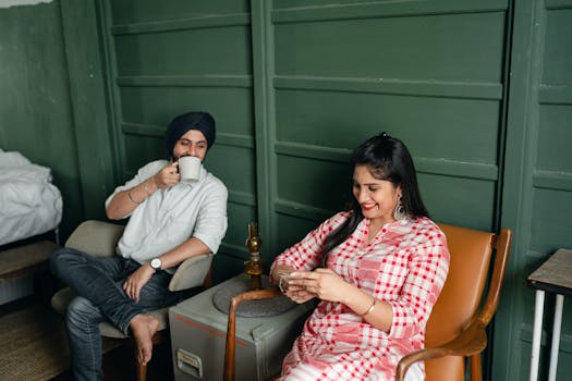 happy retired couple enjoying coffee at home