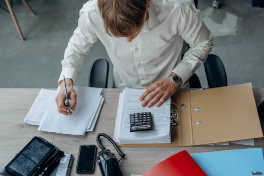 Retiree reviewing budget with a calculator