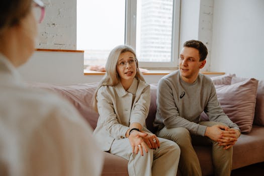 retired couple discussing finances with a counselor