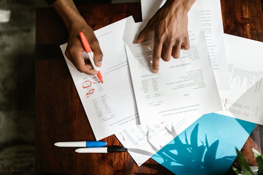 Retired person reviewing financial documents at home