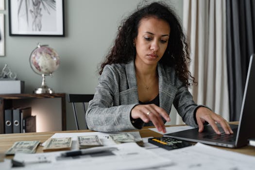 calculator and financial documents on a desk